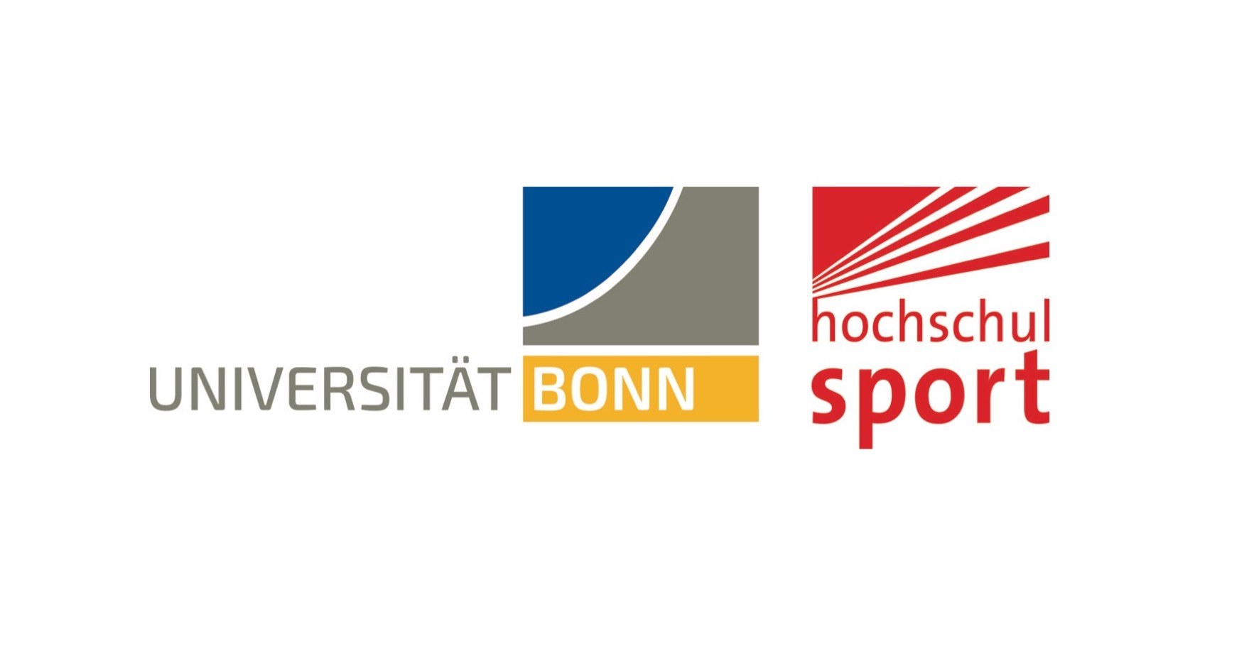 Eine Wissenschaftlerin und ein Wissenschaftler arbeiten hinter einer Glasfassade und mischen Chemikalien mit Großgeräten.