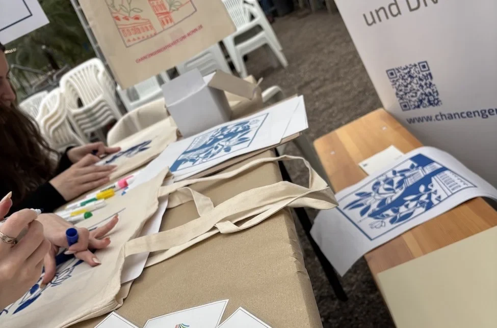 Students painting their tote bags