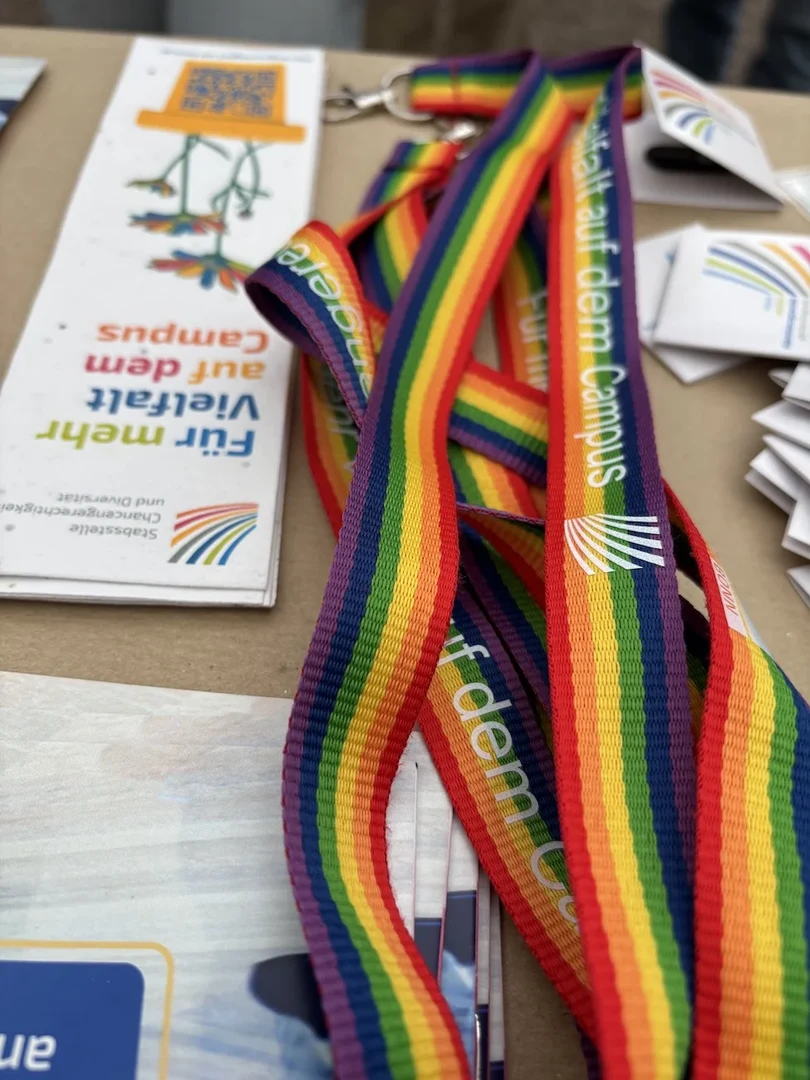 Some of our giveaways: rainbow lanyards and plantable bookmarks